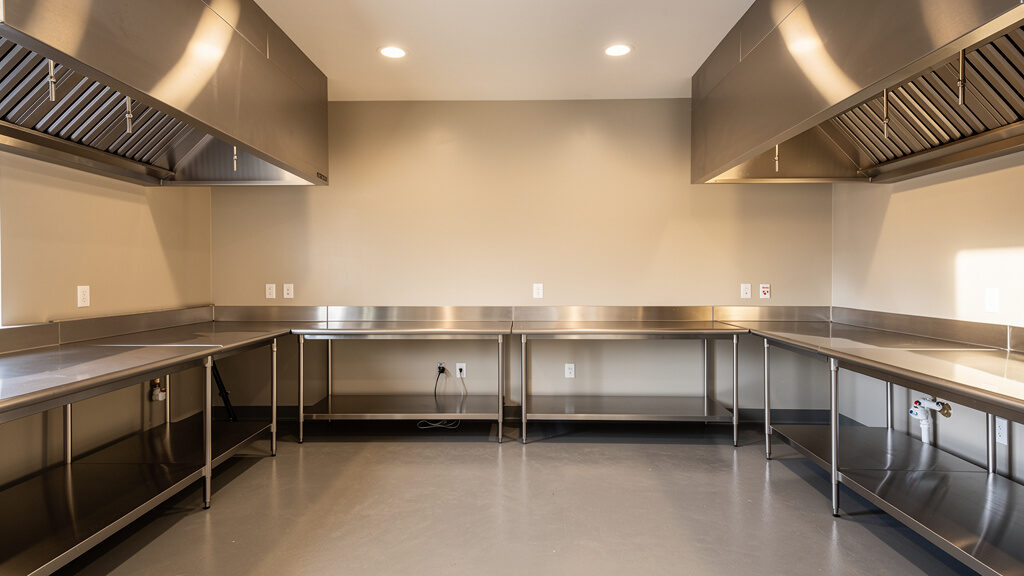 Commercial hood and kitchen equipment being removed from Greeley restaurant